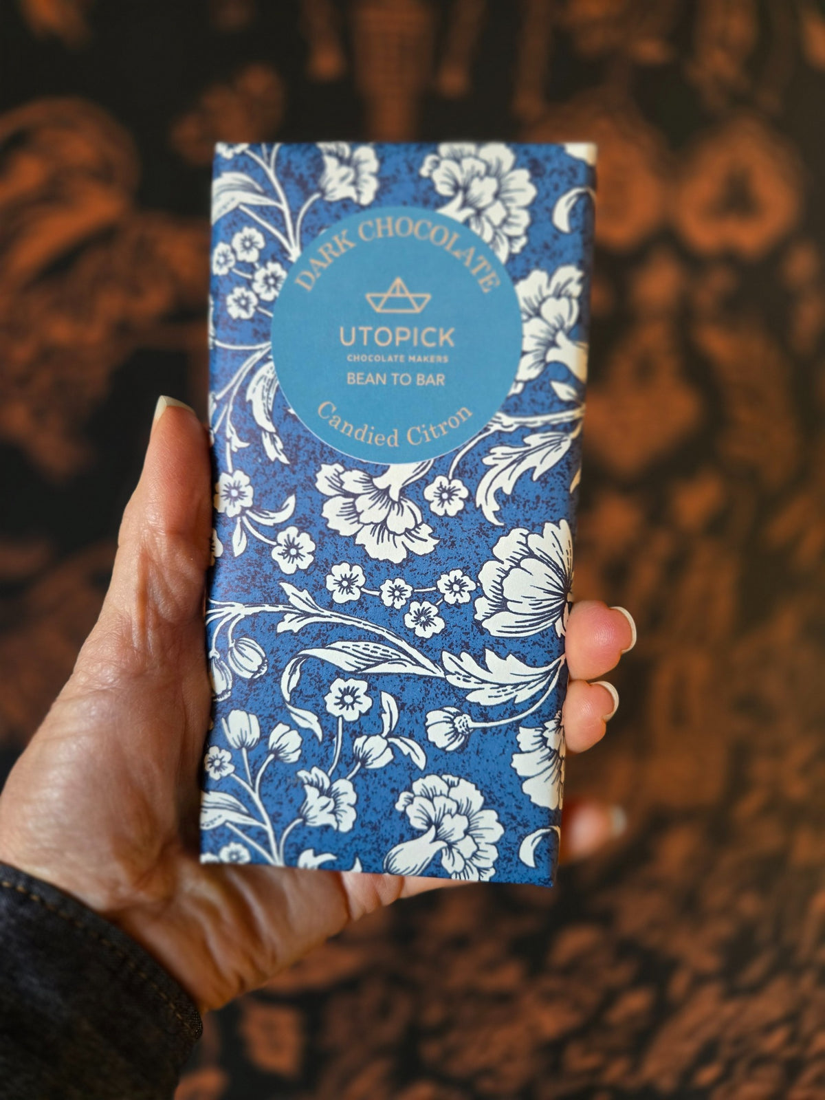 Utopick Candied Citron dark chocolate bar in blue floral packaging, photographed at Curate