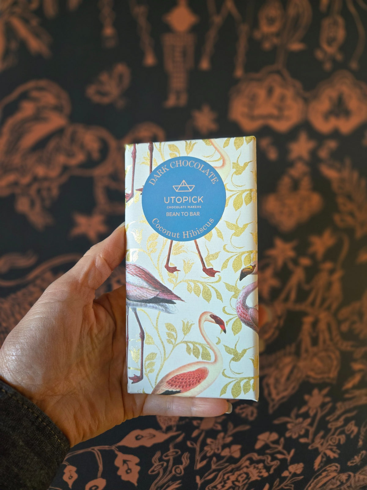 Utopick Coconut Hibiscus dark chocolate bar in flamingo packaging, photographed at Curate